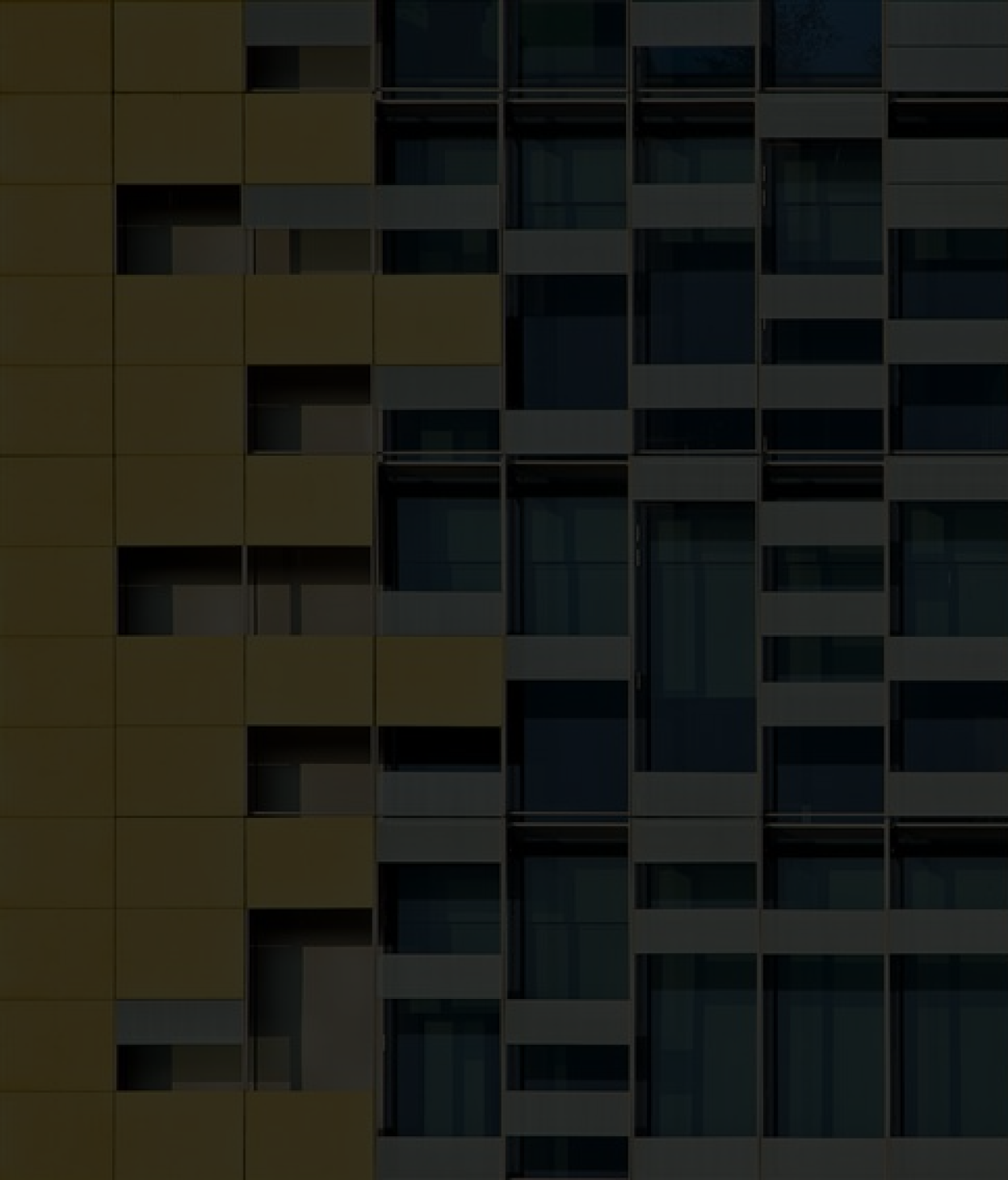 exterior of a contemporary apartment building featuring a grid-like pattern of windows and panels. The left side of the building is clad in yellow panels, while the right side displays a mix of glass and gray framing. The overall design emphasizes clean lines and geometric repetition, creating a modern urban aesthetic. No visible text or numbers are present.